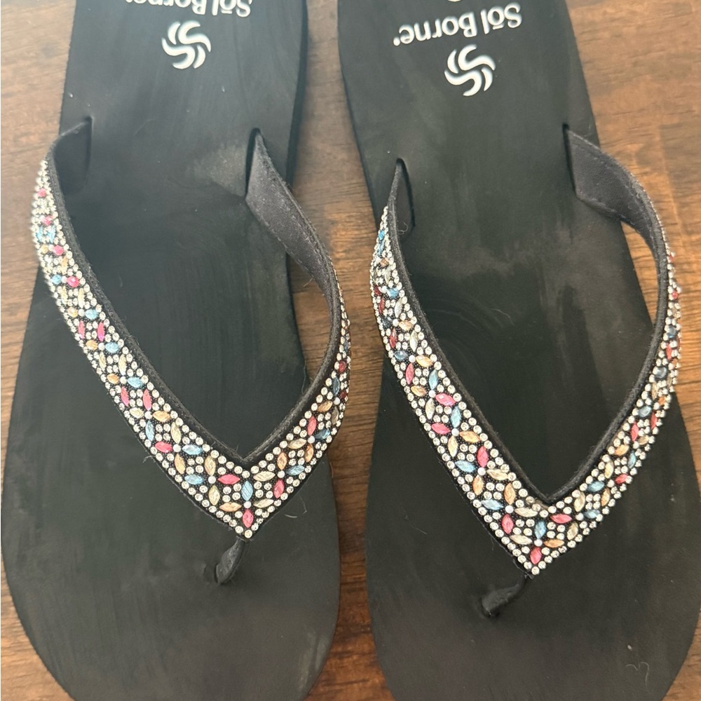 Worn one time cute jeweled flip flops.  Size 9.  Great fit for a wider foot.